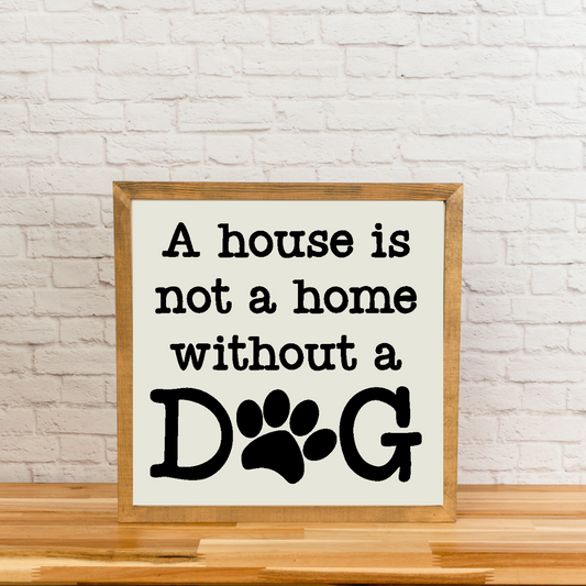 Framed sign with 'A house is not a home without a dog' text on a white background.