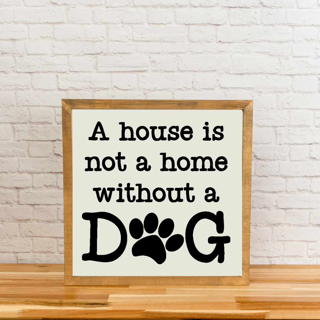 Framed sign with 'A house is not a home without a dog' text on a white background.