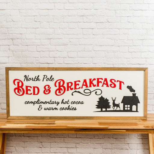 North Pole Bed & Breakfast Sign – 13x35 Inches – Black & Red Lettering – Wood Framed Christmas Decor