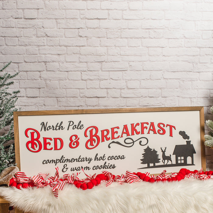 North Pole Bed & Breakfast Sign – 13x35 Inches – Black & Red Lettering – Wood Framed Christmas Decor