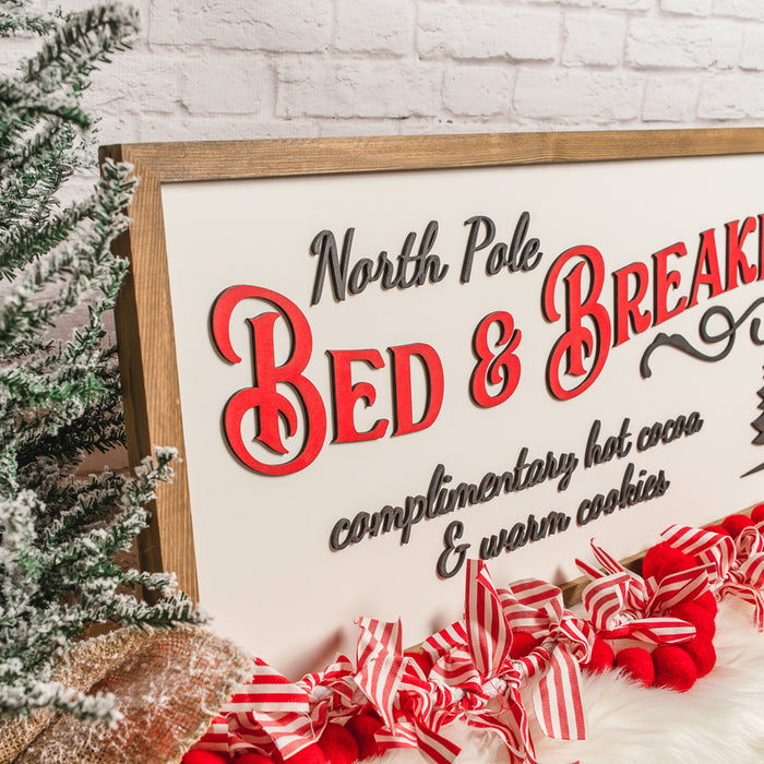 North Pole Bed & Breakfast Sign – 13x35 Inches – Black & Red Lettering – Wood Framed Christmas Decor